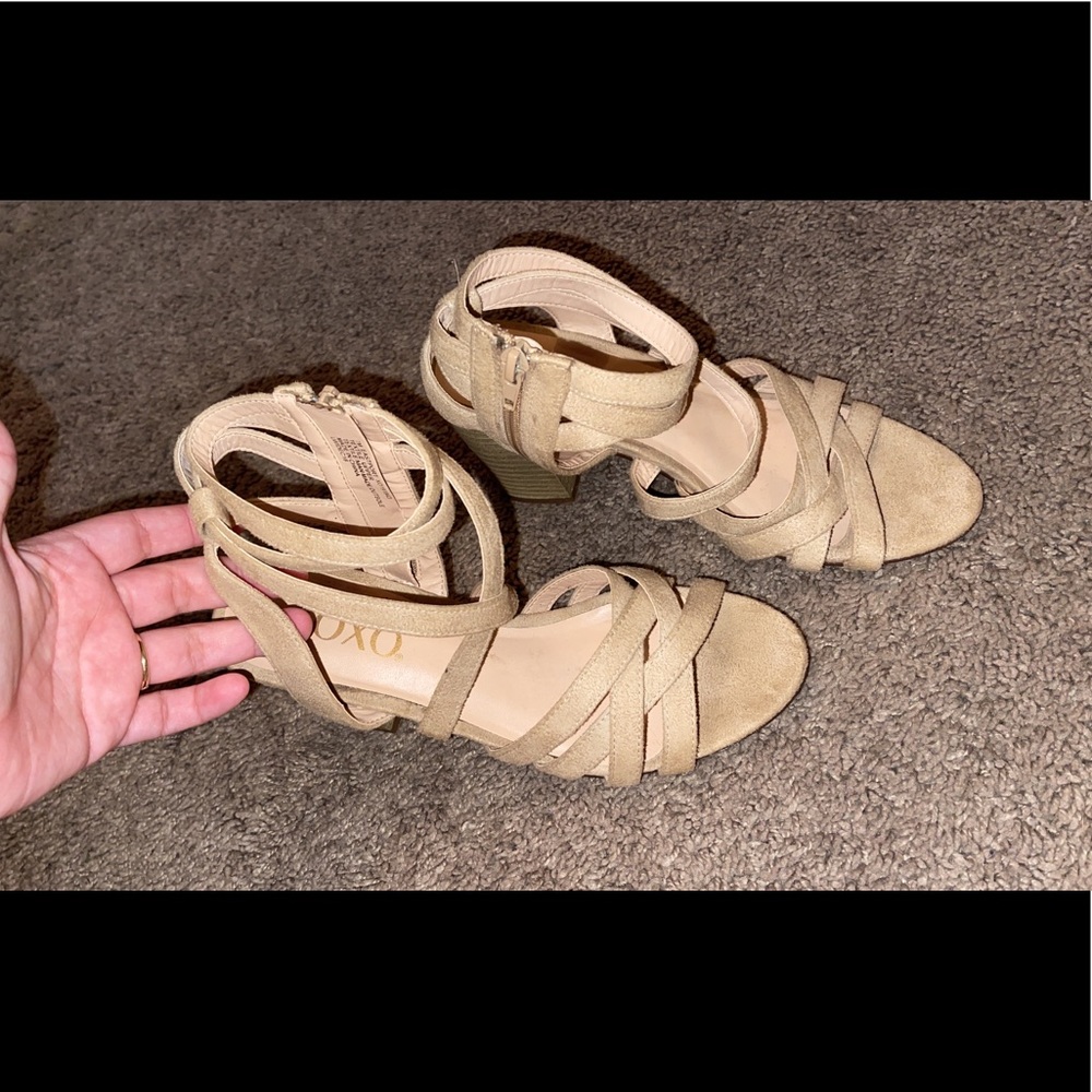 Tan heels, zip up on inside.